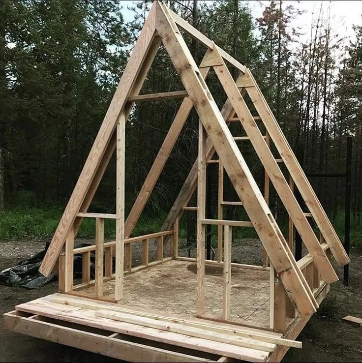 Timber A-frame house frame under construction
