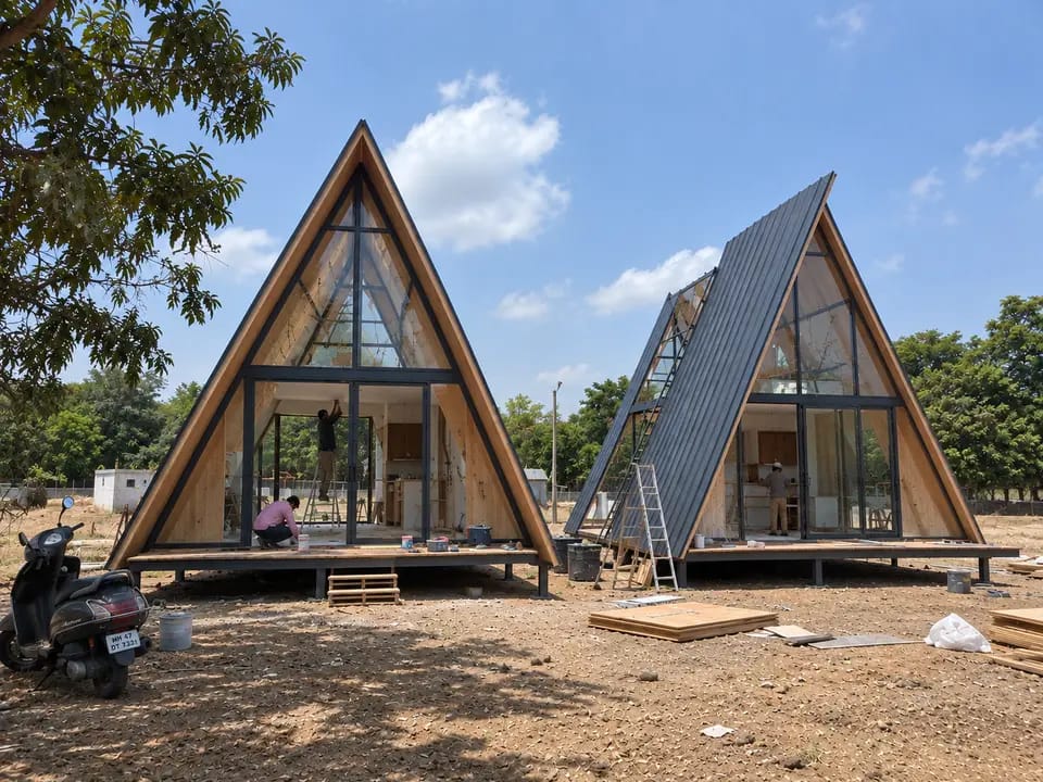 Twin A-frame homes with interior fit-out under way